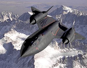 Dryden's SR-71B Blackbird, NASA 831, slices across the snow-covered southern Sierra Nevada Mountains of California after being refueled by an Air Force tanker during a 1994 flight. SR-71B was the trainer version of the SR-71. The dual cockpit to allow the instructor to fly. Note the streaks of fuel from refueling spillage.