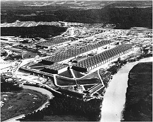 Oblique aerial view of an enormous U-shaped building.